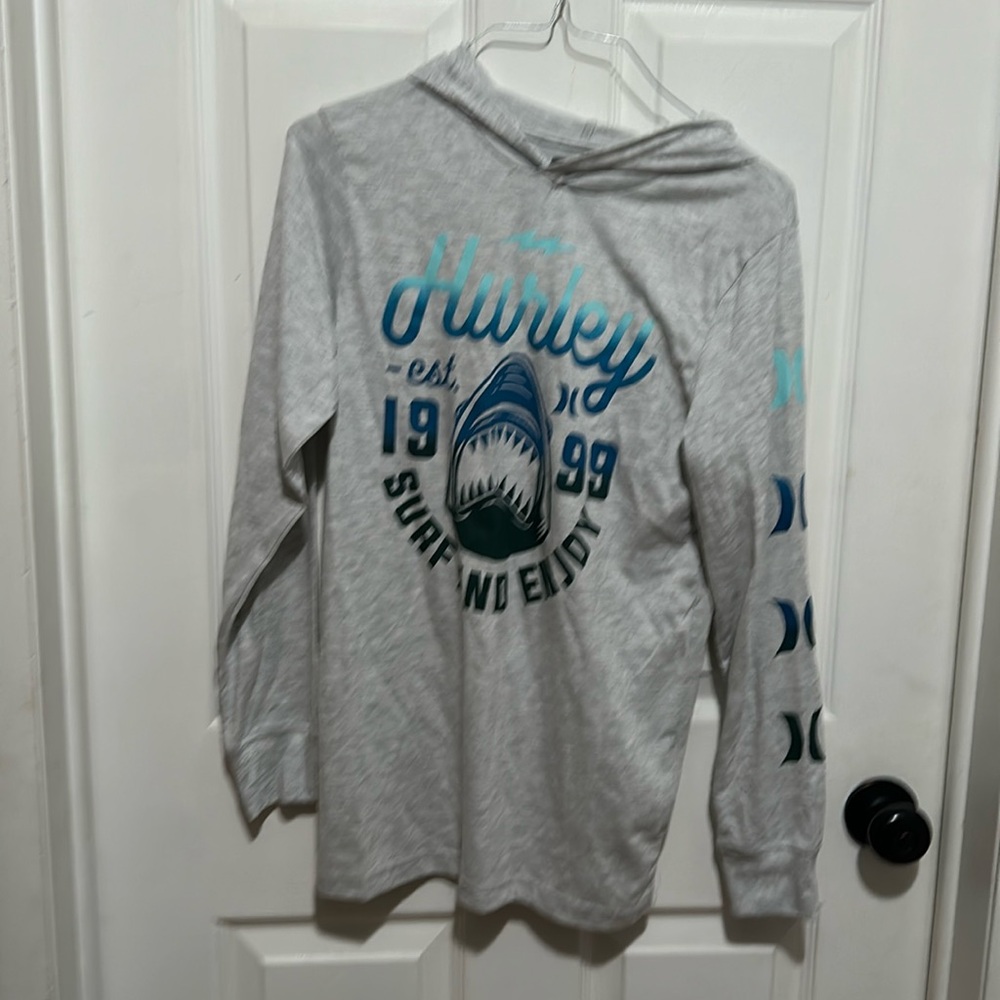 Boys long sleeved hooded shirt.